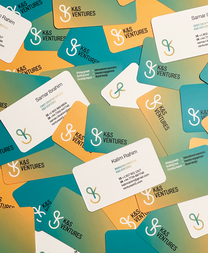 K&S Ventures business cards featuring Kalim Rahim and Samar Ibrahim's contact details, displayed with five distinct back color options