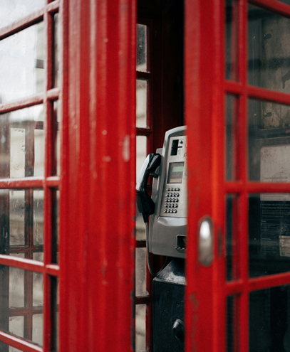 A classic red London phone booth symbolizing one of K&S Ventures' offices in London, UK, and their commitment to opening doors for their clients